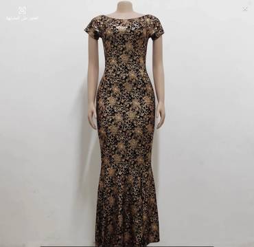 "فستان حورية البحر كاميليا الذهبي" (The Golden Camellia Mermaid Gown)